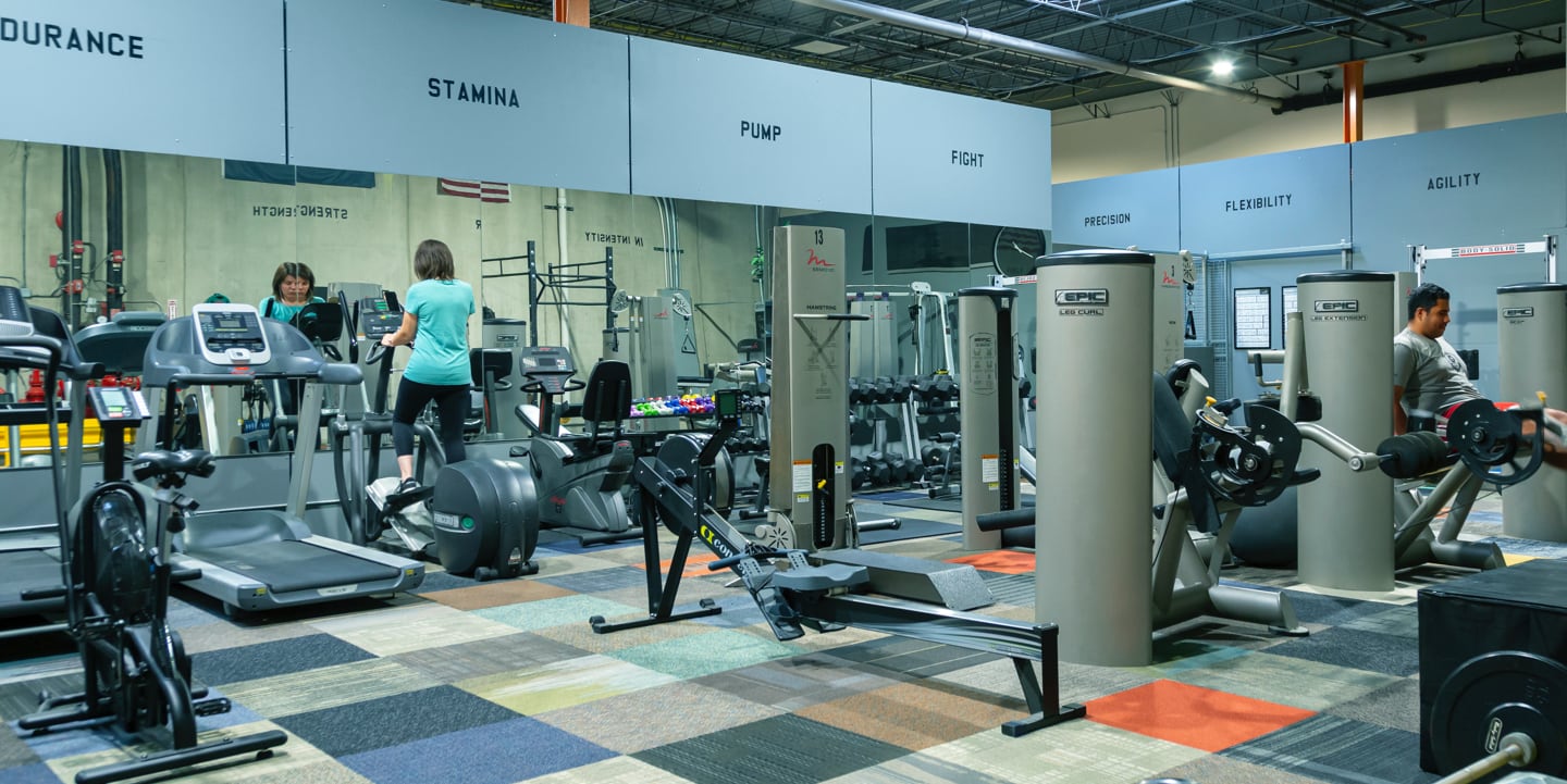 Employees Working Out in the Fully-Equipped :e-Gym